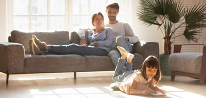Healthy And Comfortable Family In Their Home