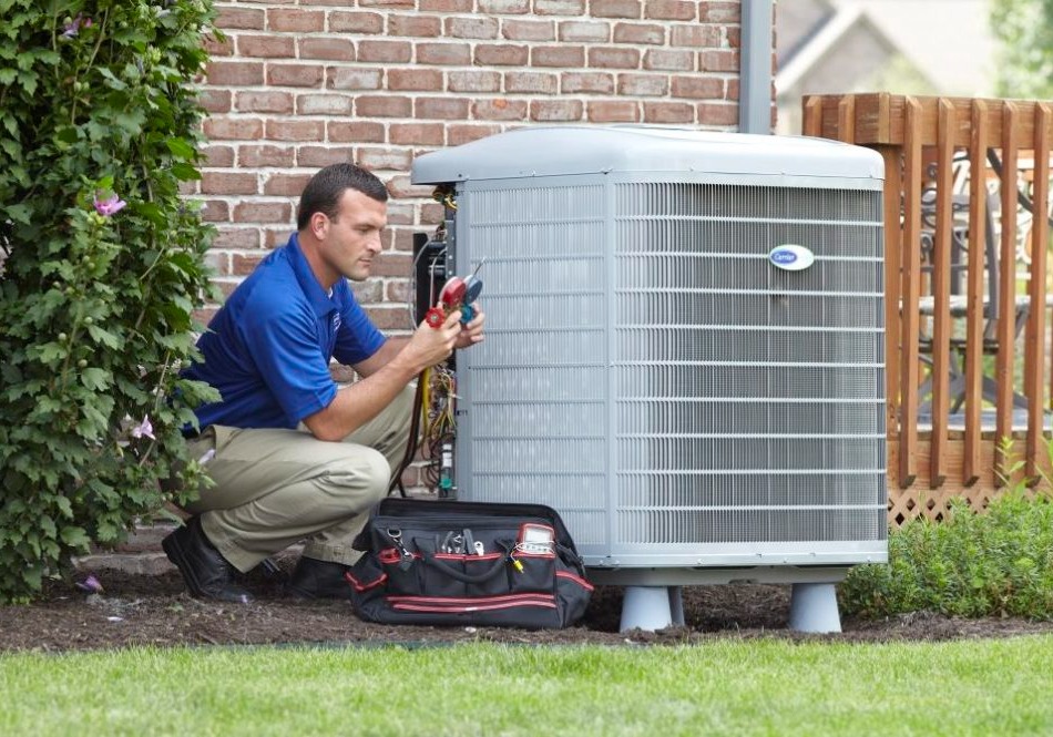 carrier tech working on ac unit