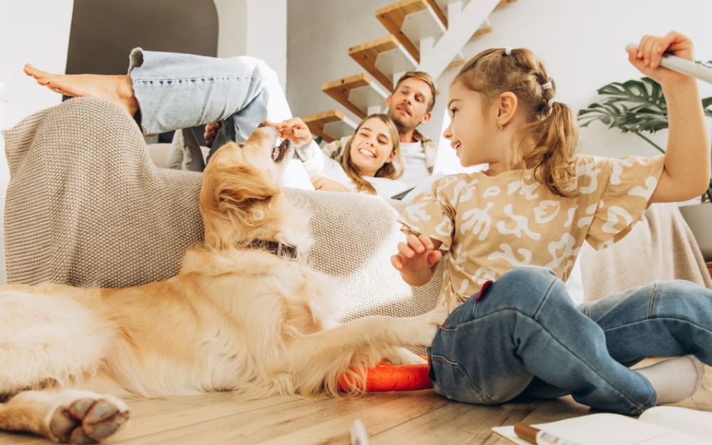 family hanging out in living room with dog