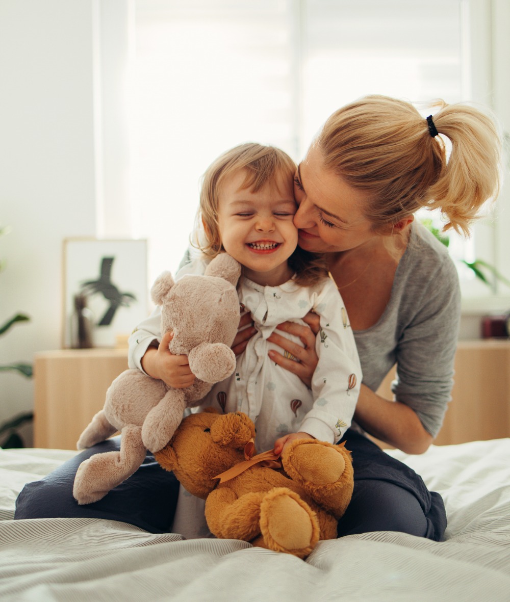 mother holding daughter
